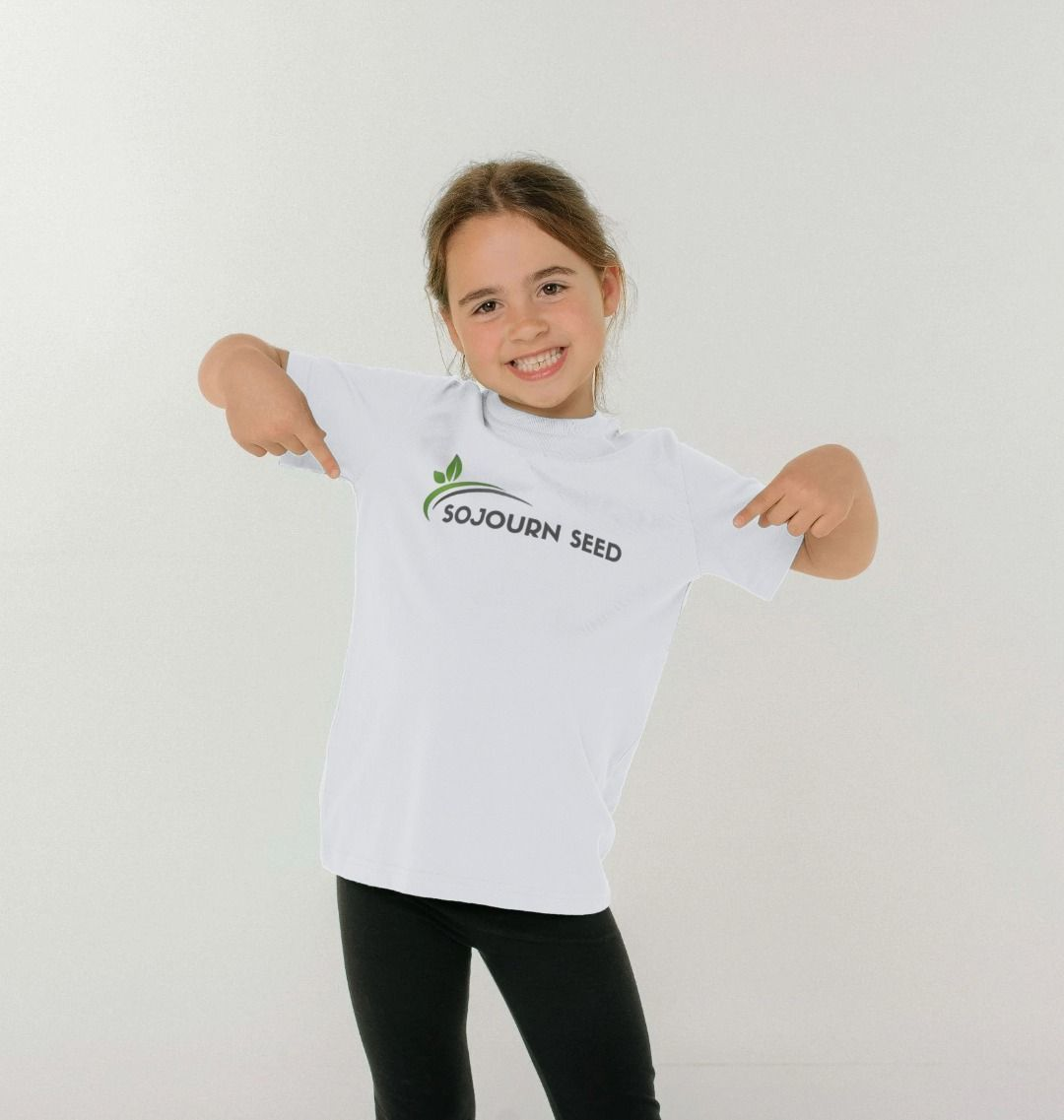 Smiling girl wearing white t-shirt and black leggings showcasing kids clothing online