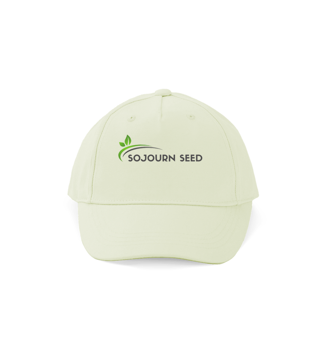 Sojourn Seed organic cotton kids cap in light cream color with logo on front